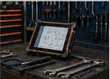 Tablette de diagnostic posée sur l’établi d’un atelier